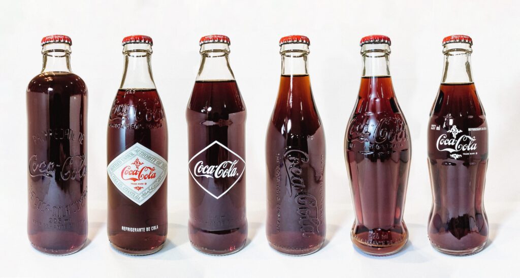 coca cola zero bottles on white table